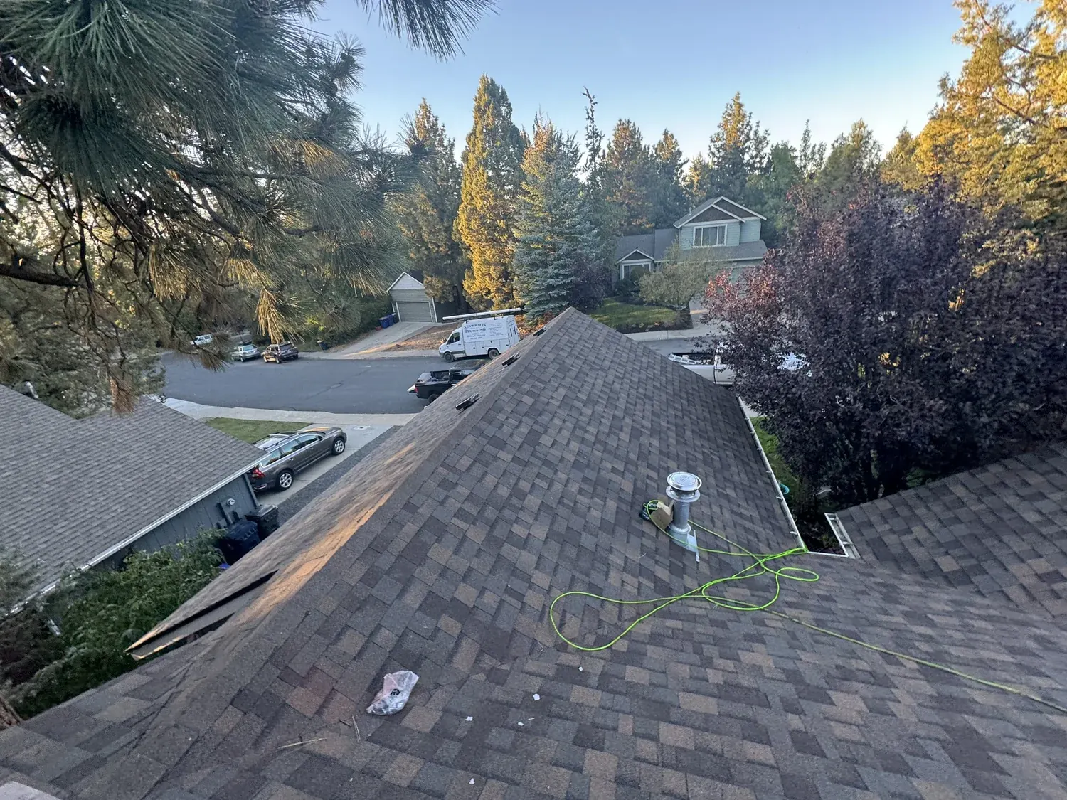 New shingle roof ridge with pipe flashing