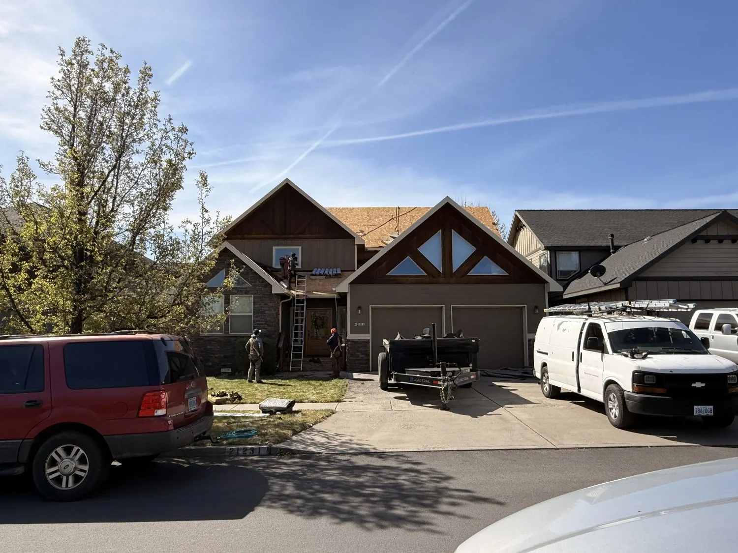 DryInside trucks at a home during a roof project